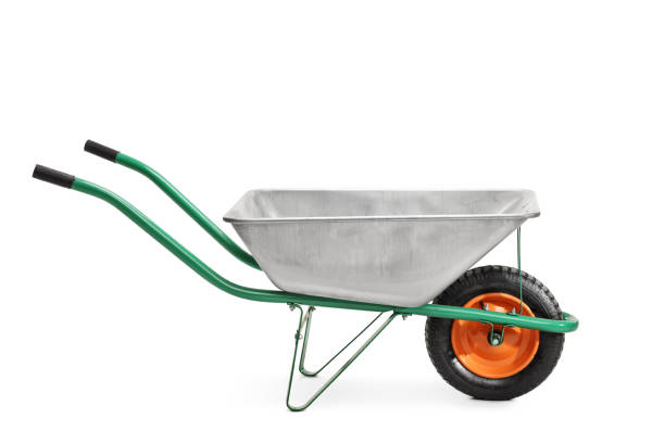 Metal wheelbarrow with green handles Studio shot of a metal wheelbarrow with green handles isolated on white background wheelbarrow stock pictures, royalty-free photos & images