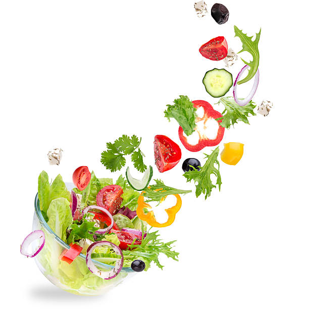 istock Fresh salad with flying vegetables ingredients 518000023
