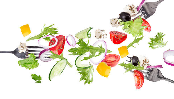 istock Fresh salad with flying vegetables ingredients 518000131