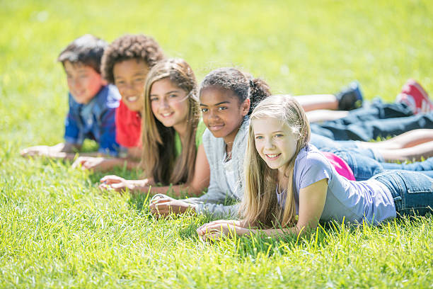 istock Lying in the Grass at Recess 518001282