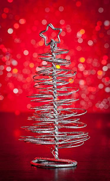 istock close-up of metallic modern christmas tree on wood table 518003036