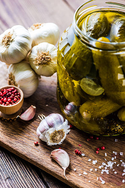 istock Pickled gherkins in jar, fermented food 518003234