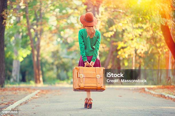 Beautiful Redhead Girl With Suitcase In The Park Stock Photo - Download Image Now - Adult, Adults Only, Alley