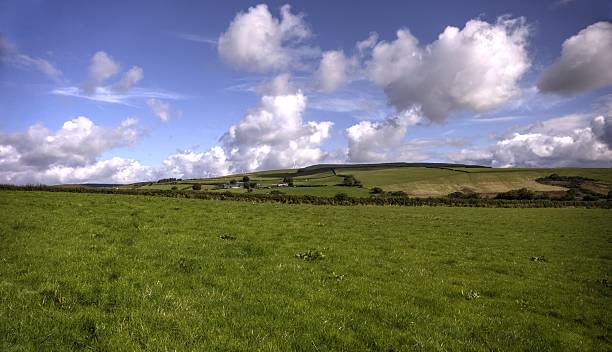 istock Welsh countryside green fields and blue sky 518013103