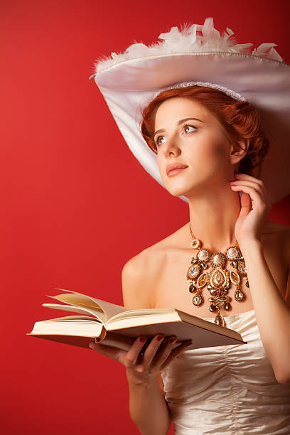 istock edwardian women with necklace and book 518013733