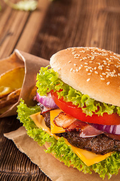 istock Fresh hamburger on wooden planks 518013735