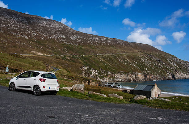 car at Keem Strand Achill Island Mayo Ireland stock photo