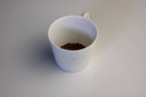 istock Cup of coffee - focus on the coffee seeds 518016653