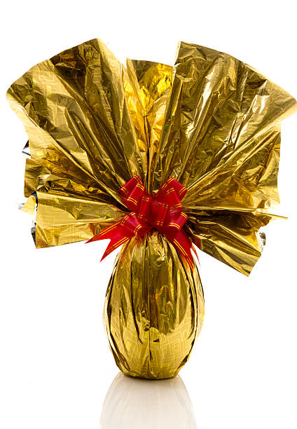 istock Brazilian Easters Egg in yellow isolated on a white background 518017814