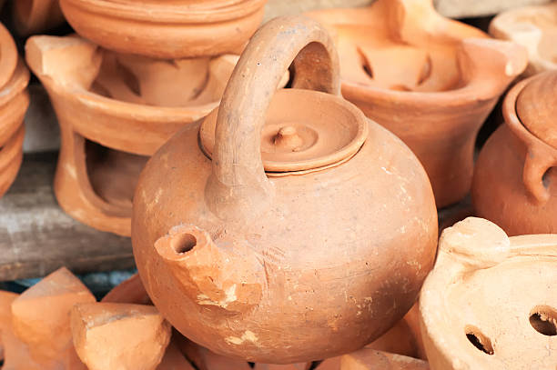 istock brown clay pots and kettle on market 518017897