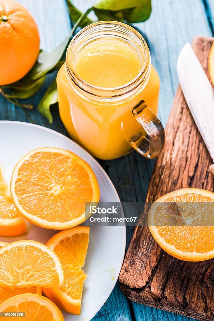 Vintage jar with fresh orange juice Vintage jar with fresh orange juice, healthy and clean eating Orange Juice Stock Photo