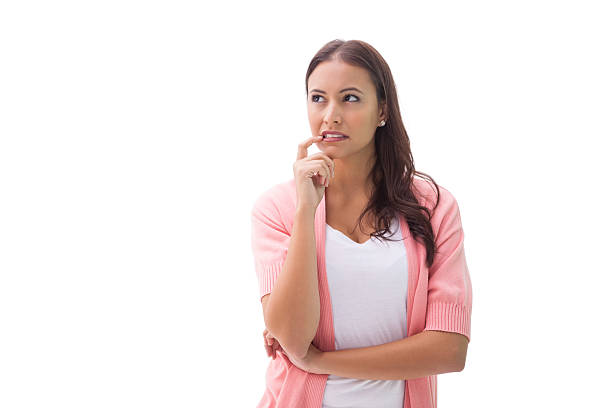 istock Pretty brunette thinking with finger to mouth 518018781