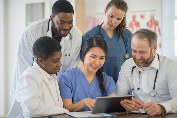 istock Medical Staff Going Over a Patients Records 518019052