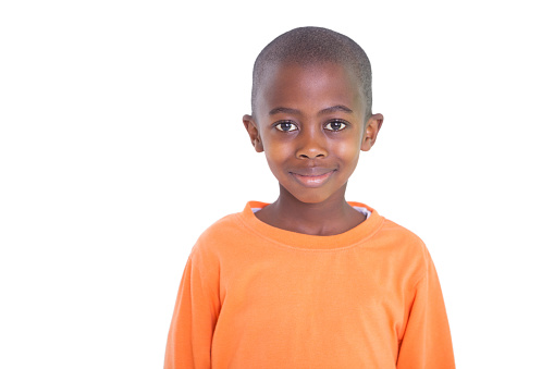 Cute boy smiling at camera  on white background