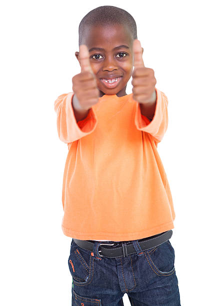 istock Cute boy showing thumbs up 518019375