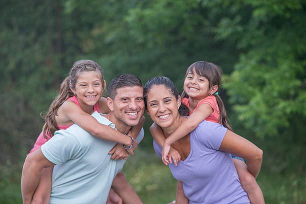 istock Giving Piggy Back Rides in the Park 518019408