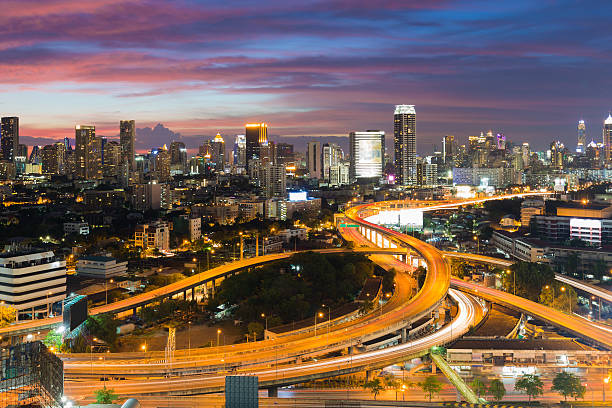 istock Aerial view highway interchanged with city downtown background 518020696