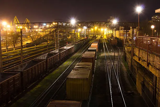 Freight Station with cargo trains at night