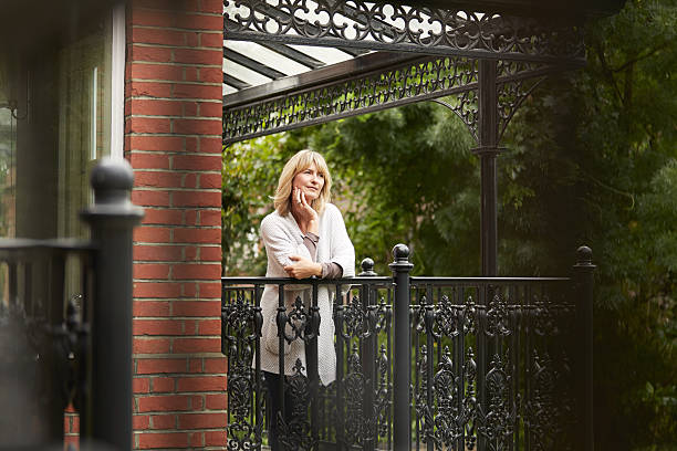 istock Enjoying the view from her balcony 518022044