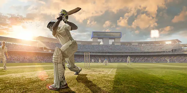 Photo of Cricket Batsman Hitting Ball During Cricket Match In Stadium