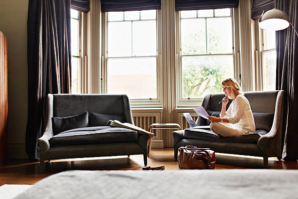 istock Catching up on her mails after a long trip 518022242