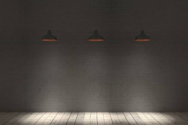 istock Blank wall with place for text illuminated by lamps 518022636