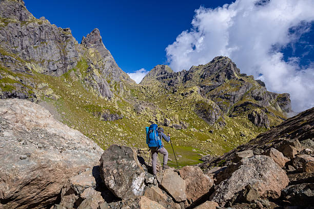 istock Man with backpack hiking in Caucasus mountains in Georgia 518022880