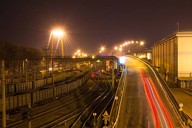 istock Freight Station with trains at night 518023672