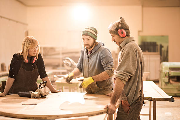 istock Team of craftspeople in workshop 518024482