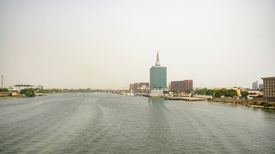 Lagos skyline over creek between Victoria Island and Ikoya.