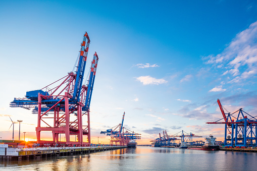 One of the big container terminals in Hamburg harbour. Big cranes are waiting to load and unload the giant container ships. Giant 50 Mpx image, taken with Canon EOS 5Ds and Tilt Shift 17mm 4,0. 