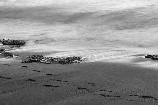 istock Footprints in the Sand on a Beach in Hawaii 518026360