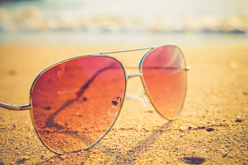 black sunglasses and sea backgroundblack sunglasses and sea background