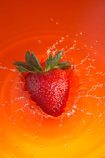 istock Fresh Strawberry splashing into juice 518030342