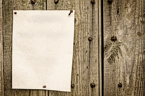 blank paper for note posted on wood background with vintage look