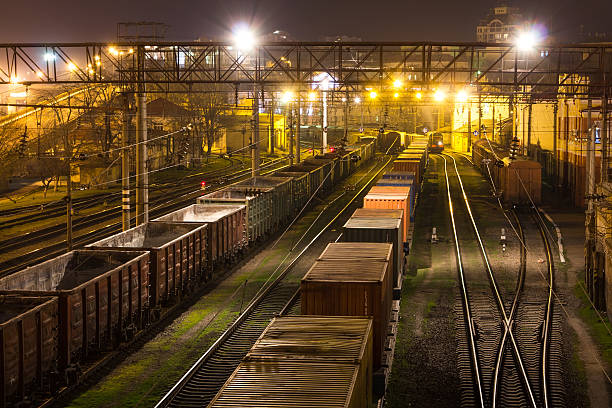 istock Freight Station with trains at night 518032548