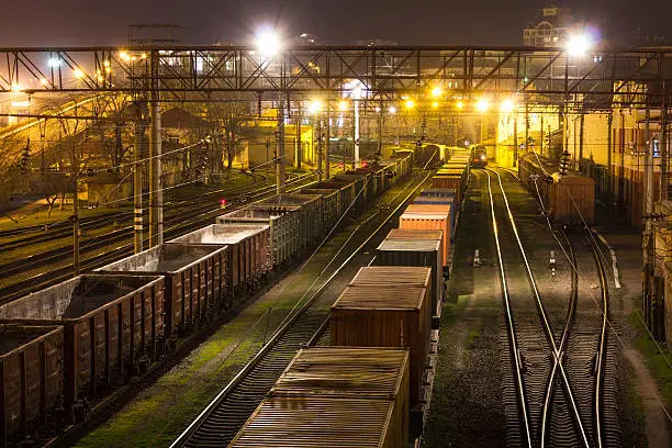 Freight Station with cargo trains at night