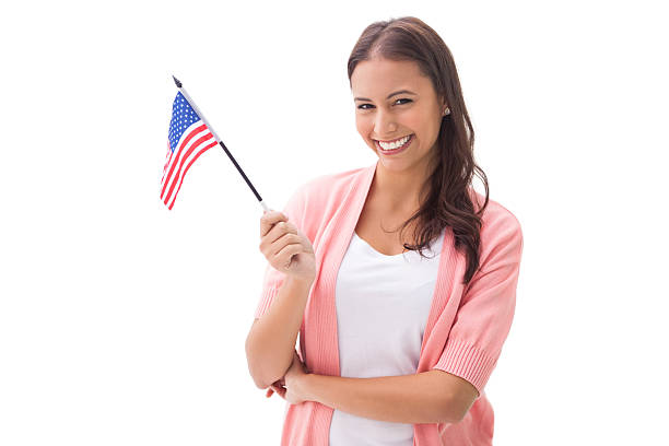 istock Pretty brunette smiling and holding american flag 518037297
