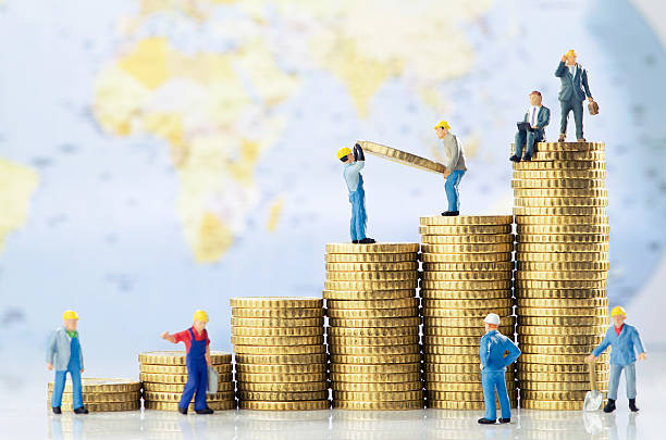 Global business growth Working men creating global business growth huge pile of money stock pictures, royalty-free photos & images