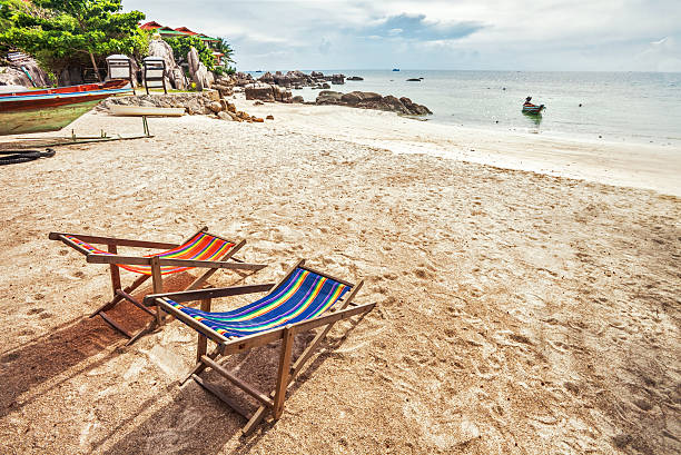 istock sun beach chairs near the sea 518038469