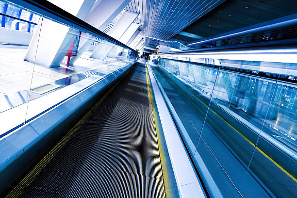 istock Moving escalator in the office hall 518039061