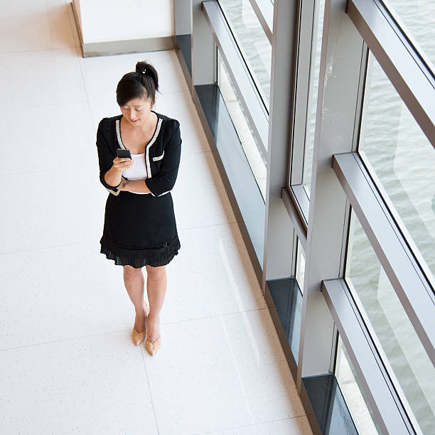 istock Businesswoman using smartphone 518039991