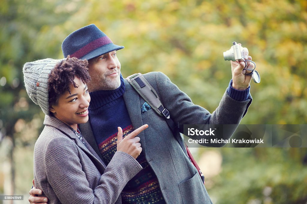 Couple taking selfie in a park Couple taking a selfie in a park. 30-34 Years Stock Photo