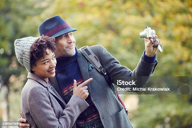 Couple Taking Selfie In A Park Stock Photo - Download Image Now - 30-34 Years, 30-39 Years, 40-44 Years