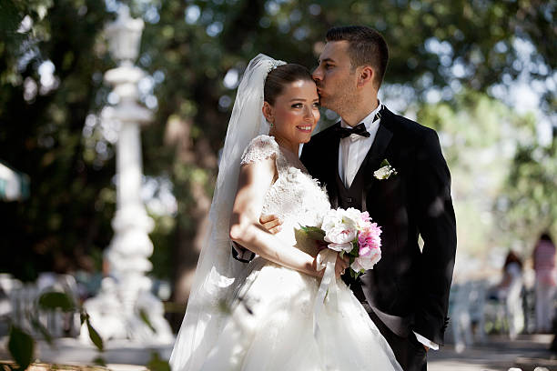 istock bride and groom in garden 518042227