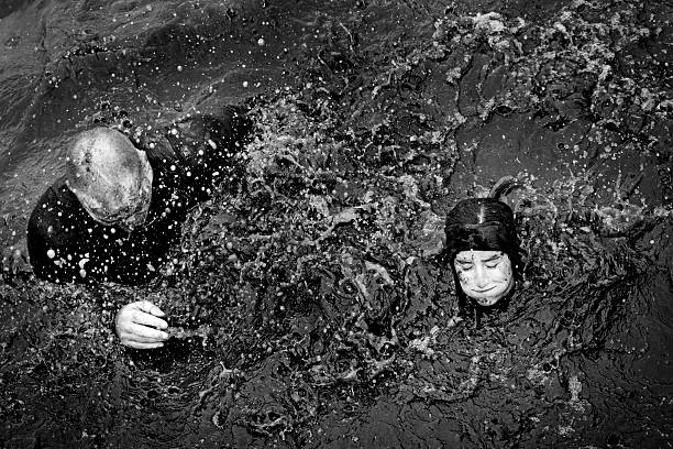 istock couple crossing canal during obstacle run in Holland 518043795