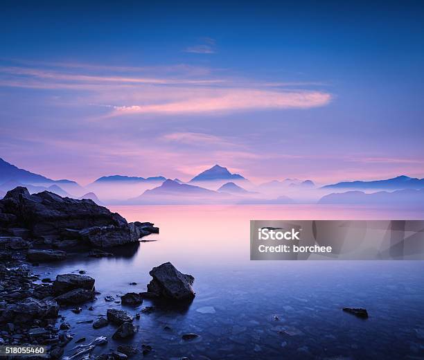 Sunset On A Rocky Beach Stock Photo - Download Image Now - Mountain, Beach, Zen-like