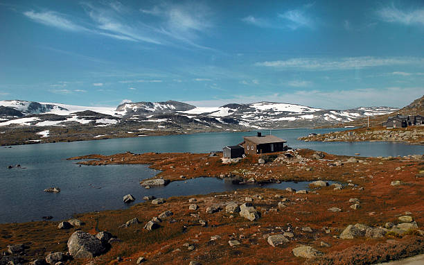 istock House at Norwegian lake 518057424