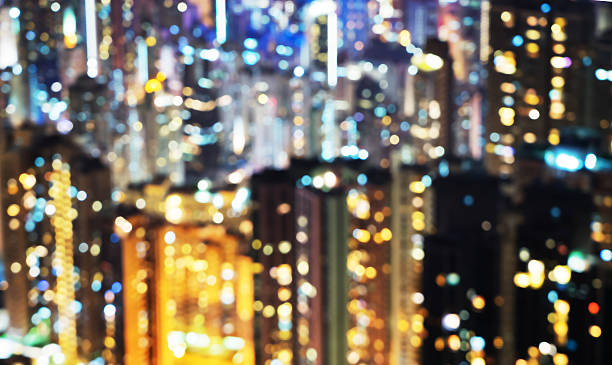 istock blurred lights in windows of skycrapers, Hong Kong 518060322