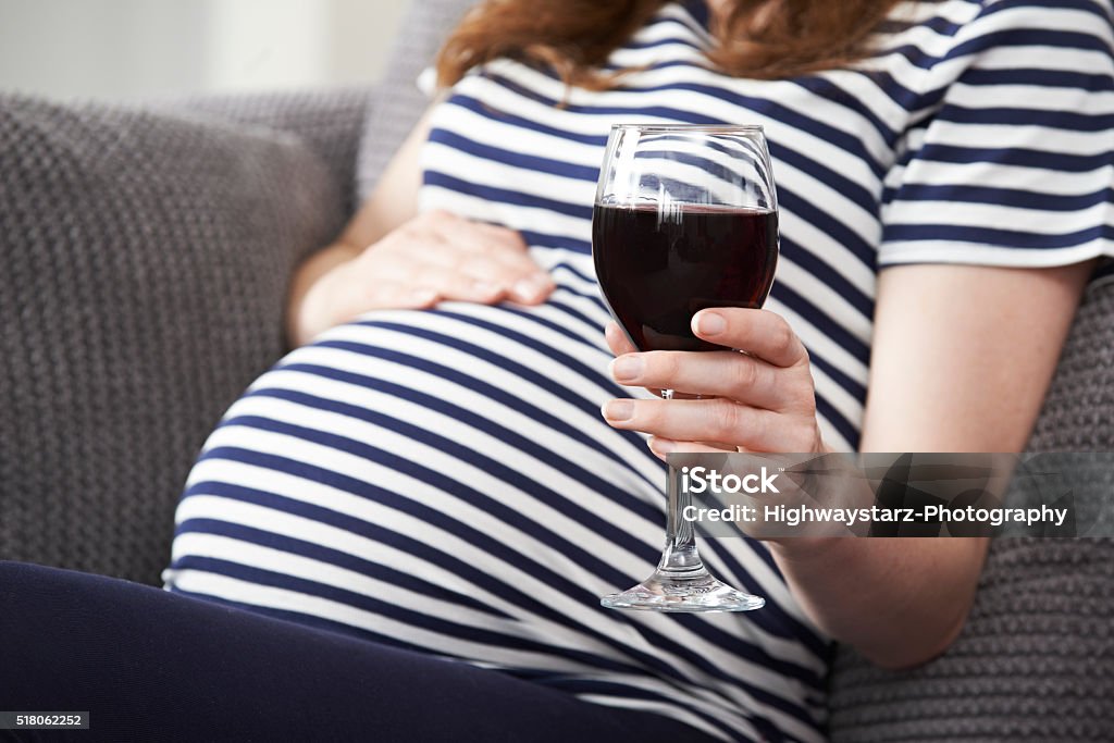 Close Up Of Pregnant Woman Drinking Red Wine Pregnant Stock Photo
